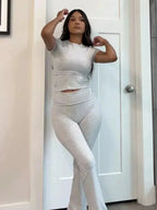 Ovidia – Nauwsluitende top en high-waist uitlopende broek – Tweedelige set